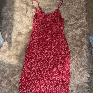 A red dress with white flowers on it size small but very pretty fits great!